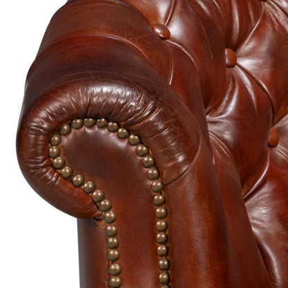 Fauteuil Chesterfield classique marron en cuir tonneau