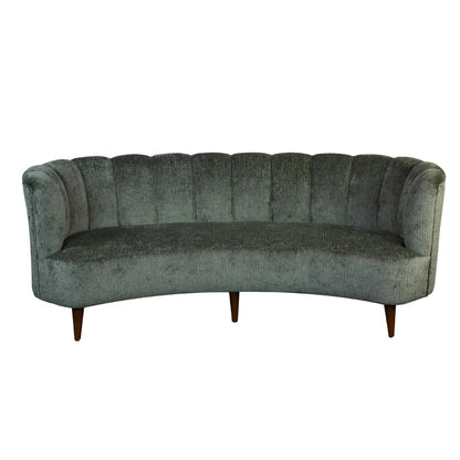 Canapé en velours vert à dossier capitonné