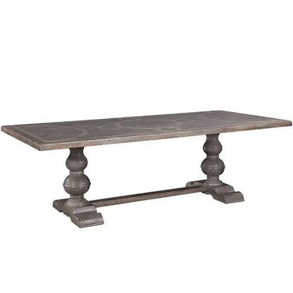 Table de salle à manger à pied central et plateau à motif en volutes