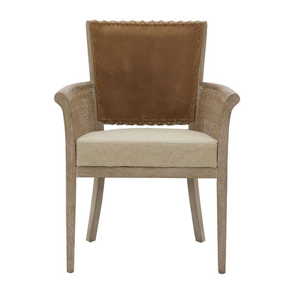 Fauteuil à dossier en cuir cousu et accoudoirs en rotin 