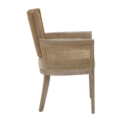 Fauteuil à dossier en cuir cousu et accoudoirs en rotin 