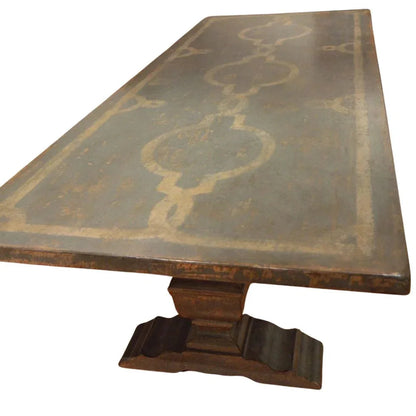 Table de salle à manger à pied central et plateau à motif en volutes