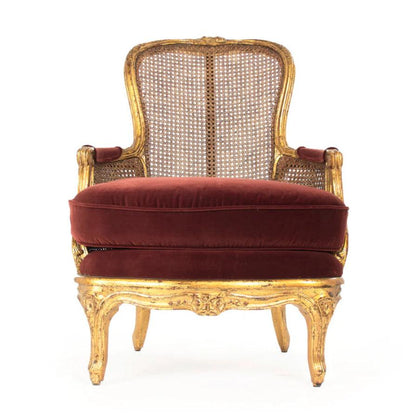 Fauteuil luxueux en rotin doré français avec coussin en velours rouge
